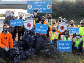 Volunteers pose for a photo during the cleanup of the Highway of Heroes earlier this month. (Pete Fisher/Supplied Photo)
