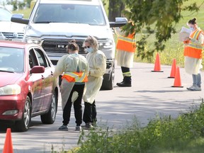 Health-care workers tested more than 400 individuals at a temporary drive-through COVID-19 assessment centre on Saturday. (Meghan Balogh/The Whig-Standard)