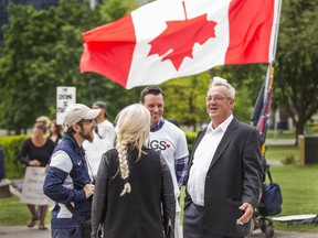 Randy Hillier, MPP for Lanark—Frontenac—Kingston, right, chats with participants before speaking at the Toronto Freedom Rally to End the State of Emergency held at Queen's Park in Toronto on June 2. (Ernest Doroszuk/Postmedia Network)