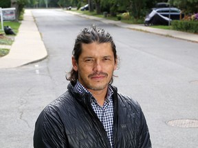 Queen's University associate professor Jeff Masuda outside his house in the University District in Kingston on Wednesday. (Ian MacAlpine/The Whig-Standard)