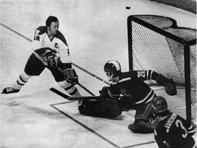 Central Red Army goalie Vladislav Tretiak foils Montreal Canadiens captain Yvan Cournoyer, one of 35 saves he made during the famous game on Dec. 31, 1975.