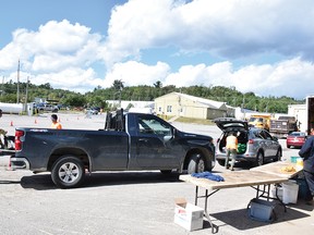 Photo by KEVIN McSHEFFREY/THE STANDARD
City staff help to unload area residents vehicles of assorted hazardous material they had at their homes at the city’s public works yard on Hazardous Waste Collection Day on Sept. 2. For the story, see page 3.
