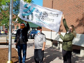 Big Brothers Big Sisters of Grey Bruce raise the organization's flag on the community pole at Owen Sound city hall in this file photo. (The Sun Times/Postmedia Network)