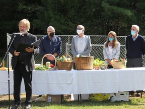 St. John's Evangelical Lutheran Church on Black Bay Road in Petawawa has embarked on a community garden project through a grant from the County of Renfrew. Produce grown in the garden will be donated to food banks in Petawawa, Pembroke and Deep River. In the photo from left, Pastor Pastor Albert Romkema,Terry Hampel, property committee chairman, Wade Green, council chairman, Anne Smith, friendship committee chairwoman, and Don Bunn, garden co-ordinator. Anthony Dixon
