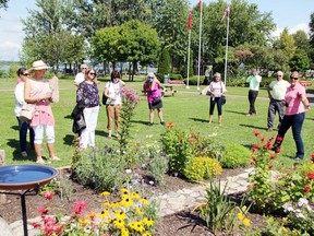 Jenny Bucholtz (right), waterfront gardener with the Pembroke Horticultural Society, provides information about the pollinator garden during a tour of the Pembroke Waterfront Park on Sept. 1. Members of Pembroke city council and city staff were invited to the luncheon and tour as the horticultural society highlighted some of the new gardens.