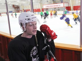 Newly crowned Pembroke Lumber Kings Captain Cameron Hough is interviewed by the television broadcast voice of the Kings Jamie Bramburger for a segment on YourTV while training camp continues on ice behind him at the Pembroke and Area Community Centre.