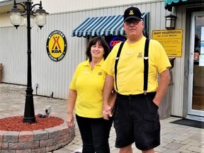 Susan and Richard Marcoux, of the 1000 Islands/Mallorytown KOA, standing in front of the campground office. Submitted photo