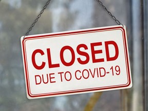Closed sign due to Covid-19, Coronavirus outbreak lockdown, on the window of a shop. Economic crisis concept

Not Released (NR)