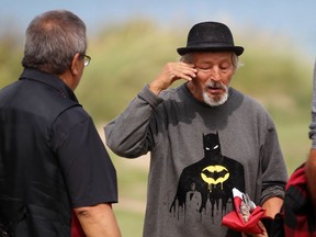 Pierre George wipes away a tear while talking to Glen Hare, grand council chief of the Anishinabek Nation, during the 25th anniversary of the death of his younger brother Dudley George on Sunday September 6, 2020 in Lambton Shores, Ont. Terry Bridge/Sarnia Observer/Postmedia Network