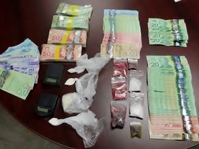 Three Sarnia men between the ages of 59 and 62 were arrested Friday after officers seized more than $20,000 in drugs and nearly $24,000 in cash from a house and a business, police said. Handout