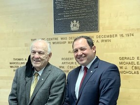 Past and the present: Formar Mayor Ron Irwin and current mayor Christian Provenzano unveil a plaque that commemmorates the new name of the city's waterfront Civic Centre.  Irwin was mayor when the building first opened in 1974.   ELAINE DELLA-MATTIA