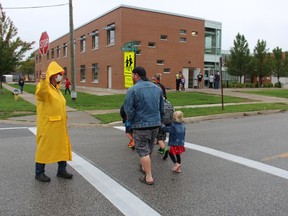 Paul Morden/The Observer
Crossing guard Albert Wood was back at his post Thursday as classes began at P.E. McGibbon public school in Sarnia. It was the first day of staggered returns to local classes for the new school year.