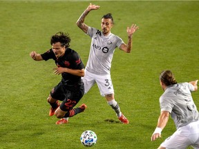 Impact forward Maximiliano Urruti (37) gets called for tripping New York Red Bulls midfielder Florian Valot (22) during the first half of the match between The New York Red Bulls and Montreal Impact at Red Bull Arena on Sunday, Sept. 27, 2020.