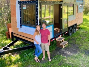 Heather and Kevin Fritz in front of one of their tiny homes.