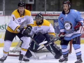 Left to right: Team White defenceman Devan Klassen, goaltender Joe Chambers and Team Blue forward Robert Pizzey in Grande Prairie Storm intrasquad action. Team White rallied from three goals down to pick up a 7-5 win at Revolution Place on Friday night. Klassen is a product of the local GPAC system, having played for the Grande Prairie U18 AAA Storm squad, before heading to the Calgary Hitmen of the Western Hockey League. Klassen played five games for the junior Storm during the 2017-18 season.