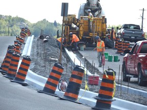 A road crew works on the median of Brady Street near its intersection with Larch Street on Thursday. Jim Moodie/Sudbury Star