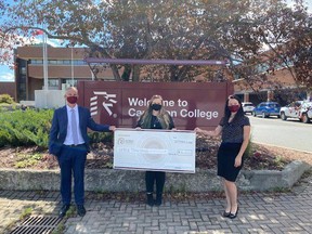 Alexandra Curry (centre), executive director of the Sudbury Community Foundation, presents a donation of $15,000 to Bill Best (left), president of Cambrian College, and Brandi Braithwaite (right), Cambrian's director of development and alumni. The money will be used to support students in need.