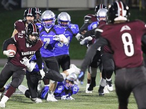 St. Mary's Knights running back Nick Pagnotta cuts inside while trying to avoid Superior Heights defenders during a 2018 High School Senior Football League contest. Sault teams have long dominated high school football in the northeast. PETER RUICCI/The Sault Star