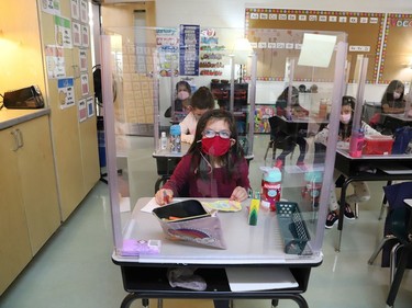 Joni McDonnell participates in a school activity behind a plexiglass shield at MacLeod Public School in Sudbury, Ont. on Tuesday September 8, 2020. John Lappa/Sudbury Star/Postmedia Network