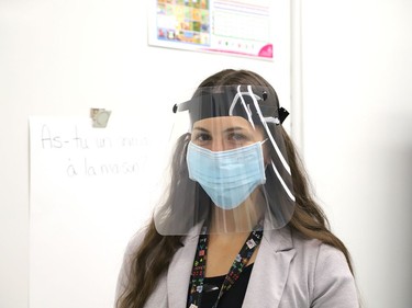 Teacher Christine Laplante wears a face mask and shield while teaching a Grade 2-3 class at the first day of school at Ecole St-Joseph in Sudbury, Ont. on Tuesday September 8, 2020. John Lappa/Sudbury Star/Postmedia Network