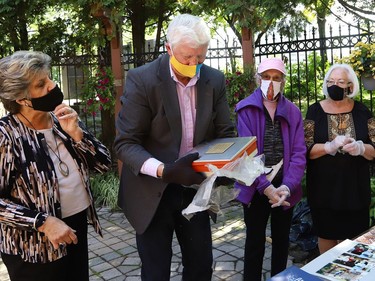 Ukrainian Seniors' Centre board members Halia Buba, left, and Taras Martyn and original Ukrainian Altanka Millennium Project committee members Mary Stefura and Sandra Sharko participated in the opening of a millennium time capsule at the Altanka (resting place) garden at the Ukrainian Seniors' Centre in Sudbury, Ont. on Friday September 11, 2020. The capsule, which was buried 20 years ago, contained a set of coins from the year 2000, newspaper clippings, photographs, documents, a small flag and pamphlets. The Altanka garden was a millennium gift to the Sudbury community from the Ukrainian community. John Lappa/Sudbury Star/Postmedia Network