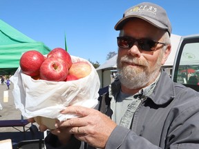 Paul Holla, of Holla's Produce and Greenhouses, displays apples he has for sale at the Sudbury Market on York Street in Sudbury, Ont. on Thursday September 17, 2020. The market is open Saturday from 8 a.m. to 2 p.m., and on Thursday from 2 p.m. to 6 p.m. at the York Street parking lot.