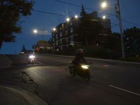Motorcycles descend the Lloyd Street hill on Thursday evening under the glow of new LED streetlights. The area is extra bright these days as Whitehall Apartments, which took over the building at 241 Lloyd, has also installed new lights as part of its renovation. Jim Moodie/Sudbury Star