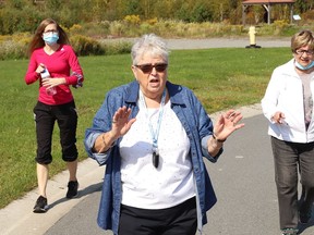 Finlandia Village townhouse residents and staff dance up and down a street at Finlandia in Sudbury, Ont. on Tuesday September 22, 2020. Fitness centre staff organized the event to provide residents with exercise and a social connection during the COVID-19 pandemic.