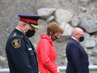 Participants bow their heads during a moment of silence at the Sgt. Frederick Davidson memorial bridge dedication ceremony on Wanup Pit Road near Highway 69 South on Thursday September 24, 2020. Davidson was killed in the line of duty in 1937 after being shot multiple times. John Lappa/Sudbury Star/Postmedia Network
