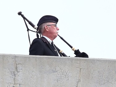 Greater Sudbury Police retired Staff Sgt. and pipe master Dave Linney played the Piper's Lament at the Sgt. Frederick Davidson memorial bridge dedication ceremony on Wanup Pit Road near Highway 69 South on Thursday September 24, 2020. Davidson was killed in the line of duty in1937 after being shot multiple times. John Lappa/Sudbury Star/Postmedia Network