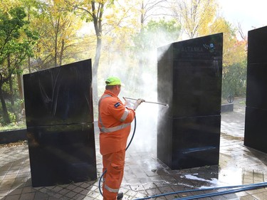 Marcel Berthiaume, of Environmental 360 Solutions, uses a power washer and cleaning agent to remove graffiti from black granite sculptures located at Hnatyshyn Park near Lloyd Street hill and Notre Dame Avenue in Sudbury, Ont. on Tuesday September 29, 2020. The granite monument and Trans Canada Trail walkway in the park were vandalized with graffiti sometime this past weekend. According to Anna Johnston, executive director of the Ukrainian Seniors' Centre, it happened sometime between Friday evening and Saturday morning. John Lappa/Sudbury Star/Postmedia Network