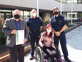 Mayor Brian Bigger, posing for a photo alongside Jalee Pelissier of Sudbury and local firefighters, declares Wednesday, Sept. 23 as Muscular Dystrophy Day in Greater Sudbury. Photo supplied