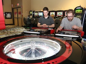John Anderson, left, and Daniel Sanchez play electronic roulette at Gateway Casinos Sudbury, formerly known as the OLG Slots at Sudbury Downs in Chelmsford, Ont., during Customer Appreciation Day at the casino on Thursday June 22, 2017.