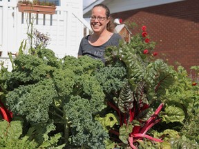 Marie-Eve Proulx, of South Porcupine, has thoroughly enjoyed this year's growing season, and has plenty to show for her efforts, as seen here in front of her thriving kale and swiss chard plants.

ANDREW AUTIO/LOCAL JOURNALISM INITIATIVE