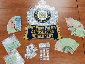 A photo of the cocaine and currency seized in Kapuskasing after the OPP executed a search warrant at a residence in that community Thursday morning. A 60-year-old woman has been charged.

Supplied