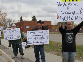 Louise Lefebvre, right, leads a small group of demonstrators on Golden Avenue in South Porcupine, carrying placards decrying the presence of fentanyl and purple heroin in the community. They say they were protesting Sunday to draw attention to an alleged drug dealer in the area.

RON GRECH/The Daily Press