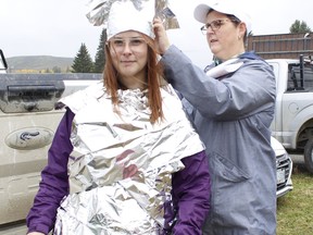 Lorraine Laiho was helping her daughter Emma get ready for a fun fashion show during the annual fundraising event for the Kidney Foundation of Canada on Sunday morning. The Timmins Kidney Walk Group had asked their members to get creative with a aluminum foil and participate in a catwalk activity. Around 24 members participated in the outdoor event and raised more than $1,300 locally. 

Richa Bhosale/The Daily Press