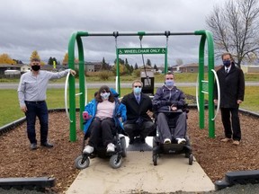Bryan Neeley, from left, Newmont Porcupine, Julie Lemieux, Municipal Accessibility Advisory Committee, Steven Pladzyk, District School Board Ontario North East, David Rivard, Municipal Accessibility Advisory Committee and Timmins Mayor George Pirie were at Lonergan Park Tuesday morning for the unveiling of Timmins' first fully accessible playground swing.

Supplied