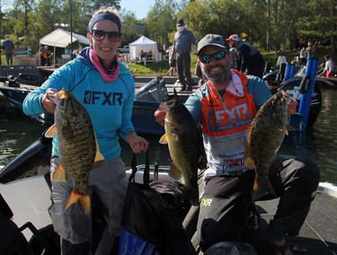Paula and Josh Peacock from Kenora show off some of their haul during the second day of the 24th annual Bassin' For Bucks fishing tournament in Sioux Narrows on Saturday, Sept. 12.