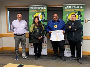 From left: Coun. Rocky Bunting, Roanna Jourdain Carpenter, Chief Waylon Scott and Coun. Glen Kent with the signed relationship agreement between the federal government and Wabaseemong Independent Nations on Friday, Sept. 18.