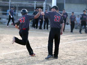 Owen Sound Selects coach Jamie Simpson (No. 27) congratulates Mackenzie Pringle as he rounds third-base after hitting a home-run against the New Zealand Junior Black Sox in an exhibition game at Duncan McLellan Park in Owen Sound on June 26, 2018. Pringle tied for the RBI lead at the ISC World Tournament U23 championship with 11 as the Selects lost in the gold medal game. Greg Cowan/Sun Times file photo.