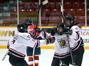 From left to right, Joey Ackert, Ethan Kerr and Elliot Thomson celebrate Kerr's second-period goal as the Owen Sound Subaru Junior Attack minor midgets won the International Silver Stick regional tournament 4-2 over the TNT (New Tecumseth) Tornados Nov. 3, 2019 at the Bayshore. Greg Cowan/The Sun Times