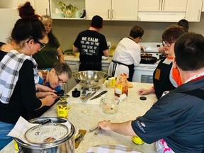 The ECHO Society cooks meals with the Collective Kitchen.