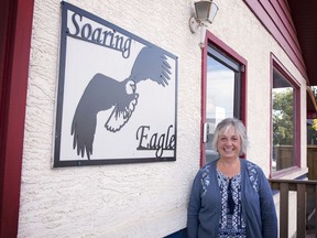 Shelagh Watson, one of the founders of the Soaring Eagle Support Society, poses with the sign outside their new buildilng.
Brigette Moore