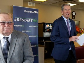 Premier Brian Pallister (right) and Economic Development minister Ralph Eichler arrive for an announcement at a Chicken Chef restaurant on Nairn Avenue in Winnipeg on Monday.