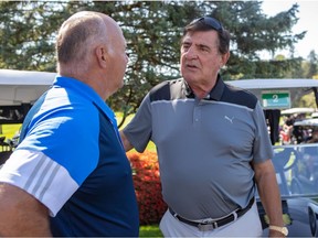 Canadiens coach Claude Julien, left, and former Canadien Serge Savard chat before the start of Jonathan Drouin's annual golf tournament in 2019.