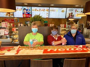 Photo suppliedNancy Gerhart and Liz Arbour were joined in their decorating efforts by Crystal Dorion, Tim Hortons regional manager.