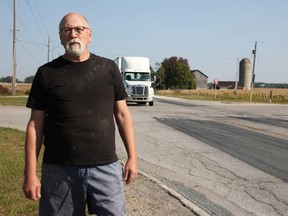 Garth Smith stands by Forest Road, south of London Line. The intersection controlled by a two-way stop needs safety improvements, he said, after years of crashes, including two fatalities within the last four years. (Tyler Kula/The Observer)