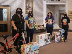 October 1 marked the first day of those in need being able to sign up to receive a Salvation Army Christmas hamper. The hampers provide enough to create a Christmas meal, and include gifts for any children living in the houses. Showing off some of the gifts are, from left, Eileen Ryerse, Katie Honcharsky, Terri Simmons, and Carleigh Smith. (ASHLEY TAYLOR)