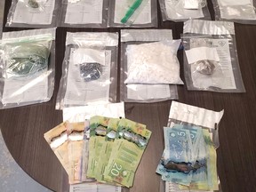 About $99,500 in drugs suspected to be fentanyl, oxycodone, methamphetamine and cocaine were seized from an Ottawa Street Home in Sturgeon Falls Wednesday morning. OPP Photo